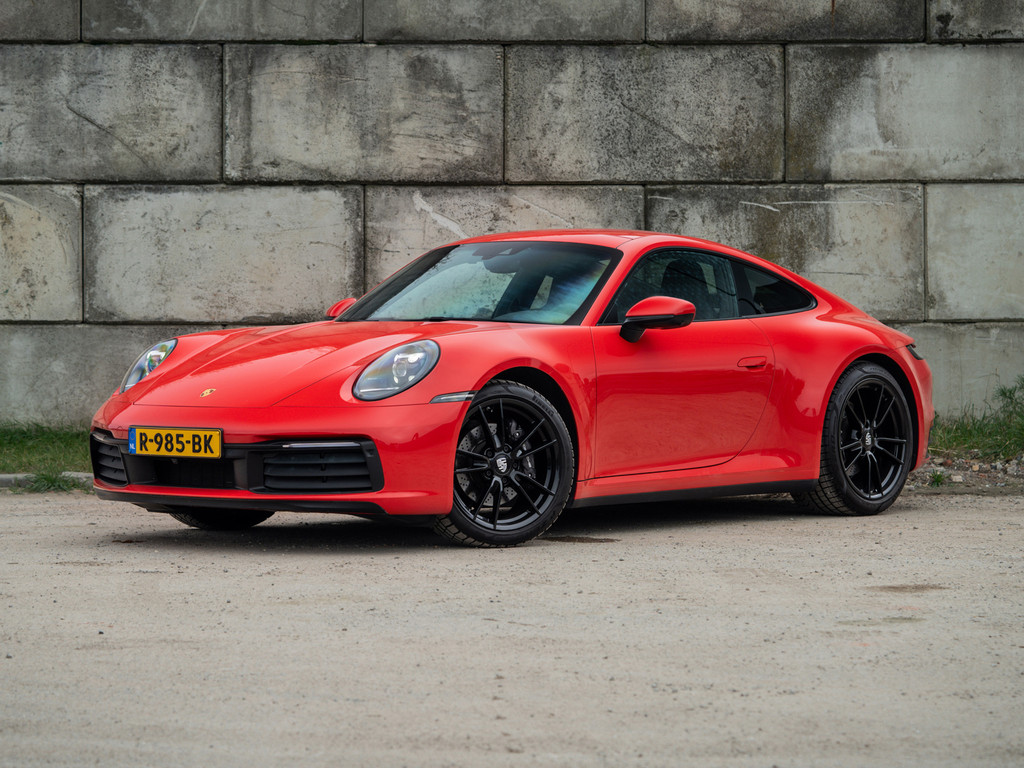 Porsche 911 Carrera 992 3.0 PDK 385PK (2020) | Sportuitlaat | Schuifdak | Sportstoelen | DealerOH | Compl. Historie | Indisch Rood 49122261-0.jpg | STR8SiX